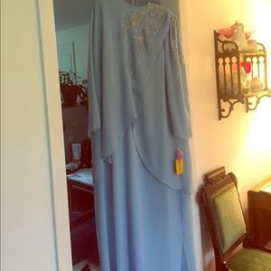 A dress for a formal occasion which never was worn