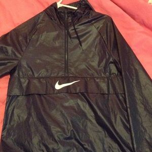 Nike wind breaker. It's an XS and navy blue