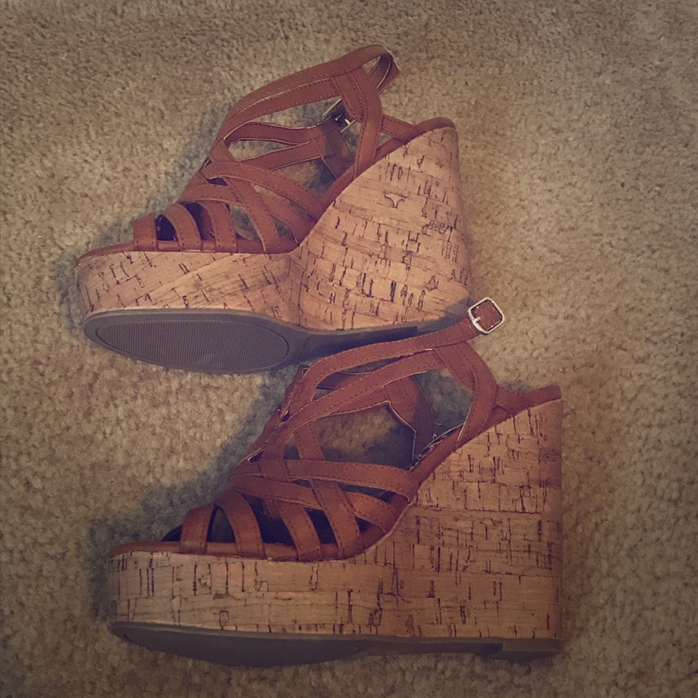 Cognac/brown wedge. Never worn. Brand new!