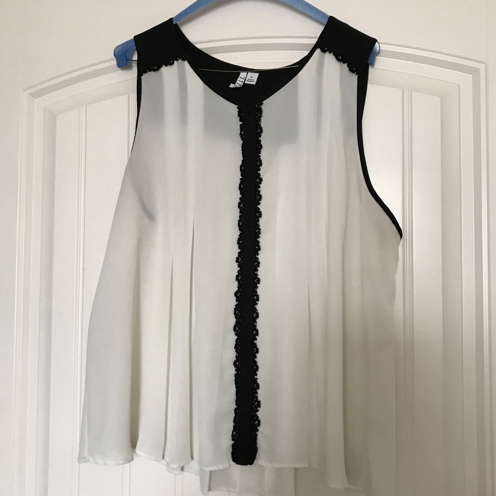 Black and white sleeveless blouse