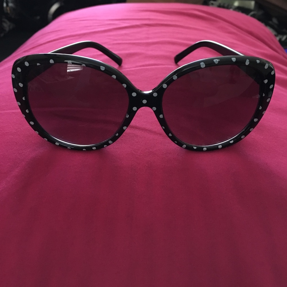 Black sunglasses with white polka dots