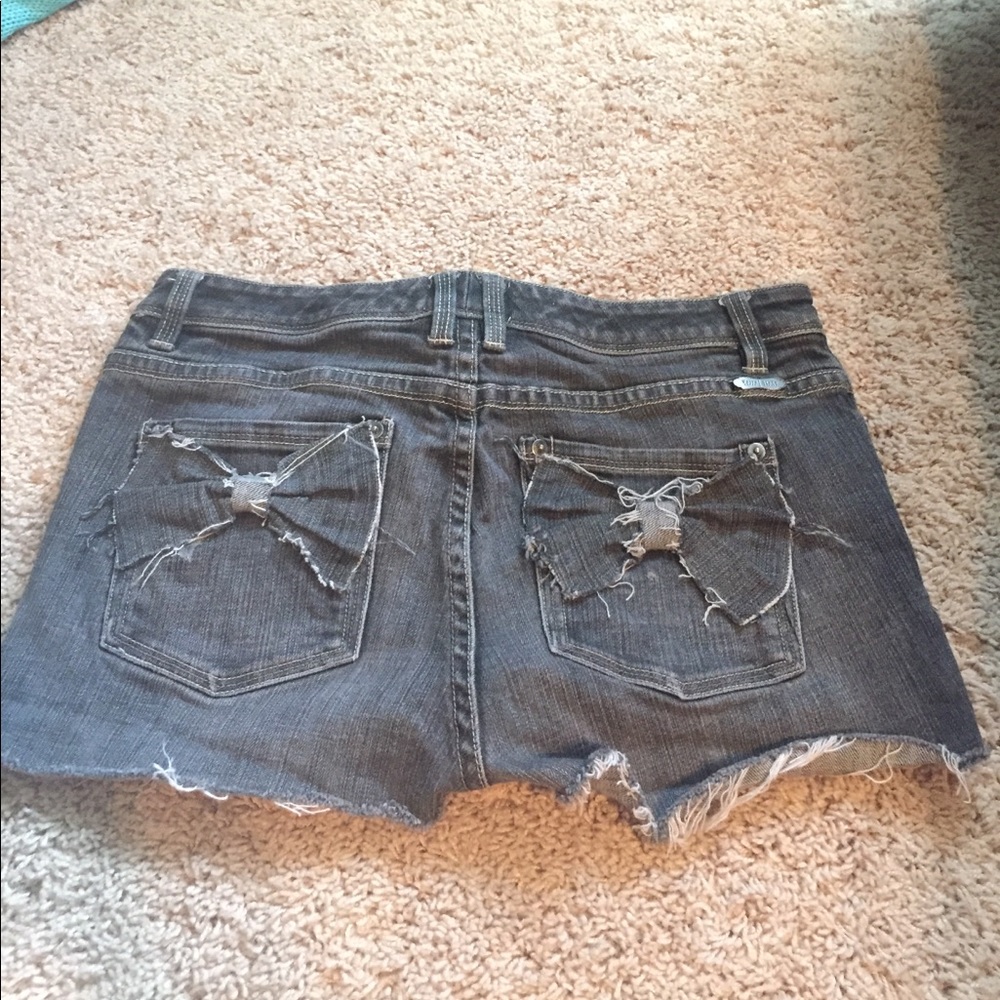 One of a kind polka dot bow pocket denim shorts