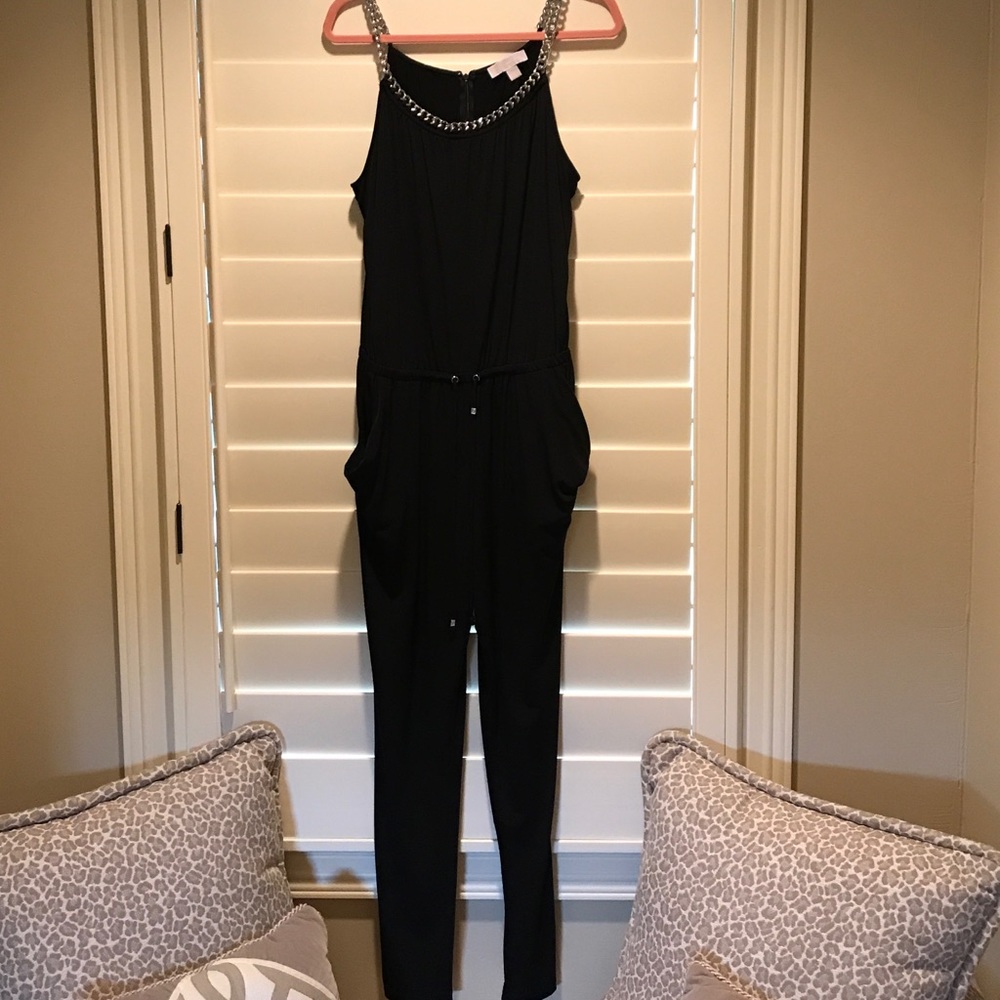 Sleeveless black jumpsuit.