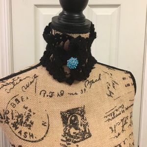 Scarf with elegant blue jewel button closure