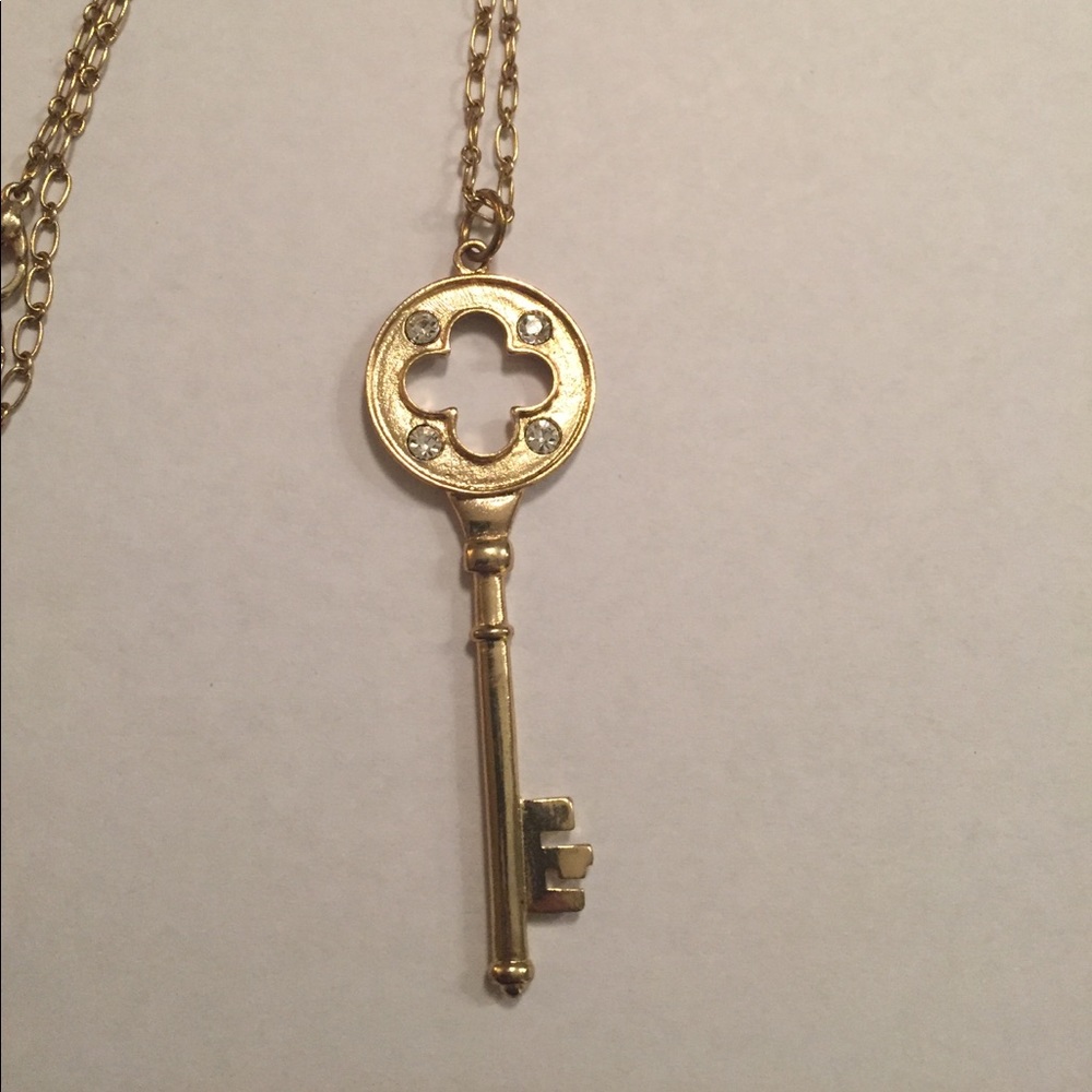 Gold key necklace with stones
