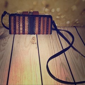 Brown cross body clutch