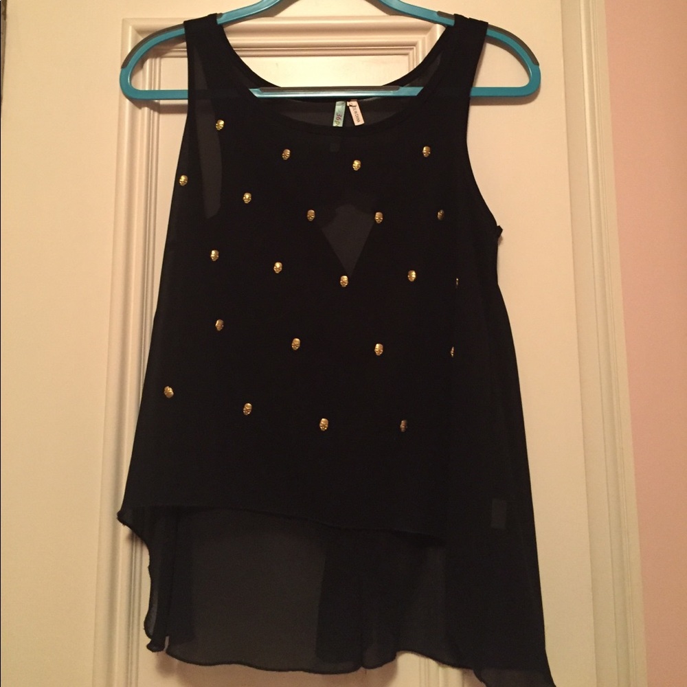 Semi-sheer black top with gold skull detailing