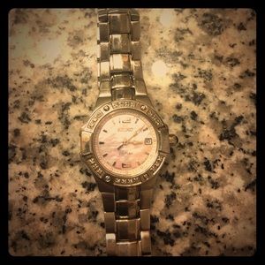 Silver seiko watch with pink face and diamonds