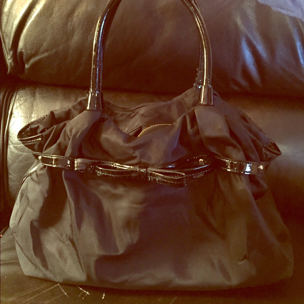 Black nylon Kate Spade handbag with patent bow