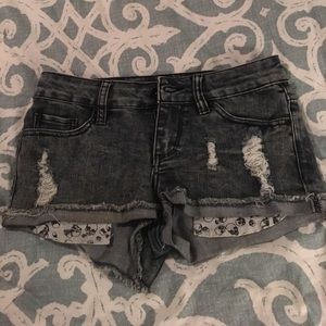 Distressed jean shorts with skeleton pockets