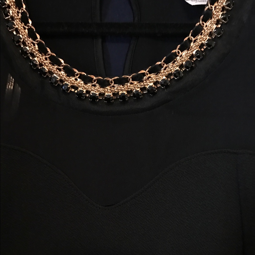 Black top with illusion neckline