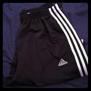 Black and white Adidas long track pants with snaps