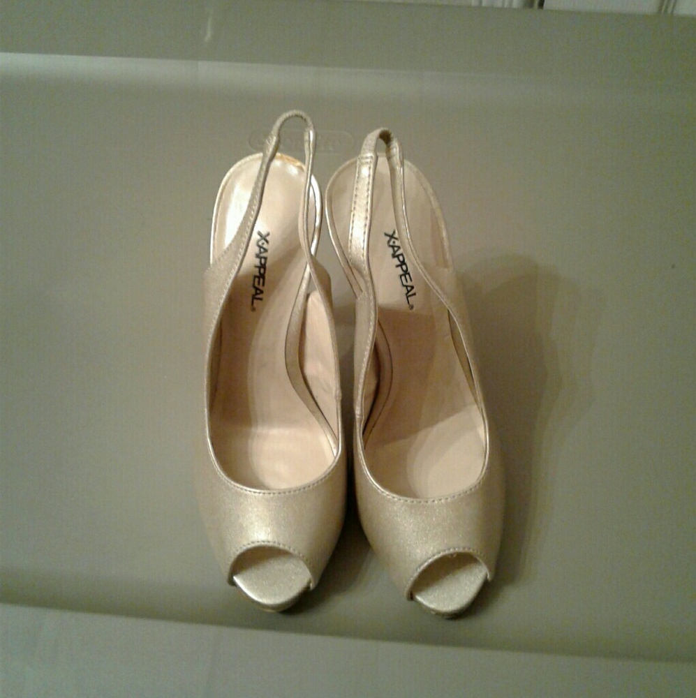 Shiny gold/tan heels.