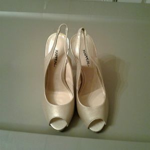 Shiny gold/tan heels.