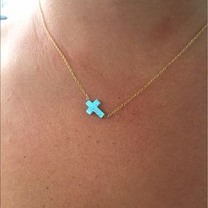 Opal side cross necklace.