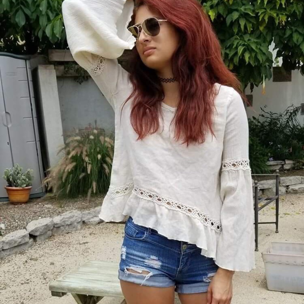 Poof! White ruffled top.