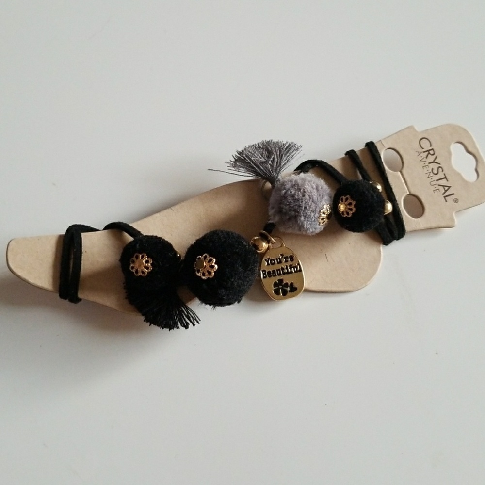 Black and grey pom pom and tassel ankle ties