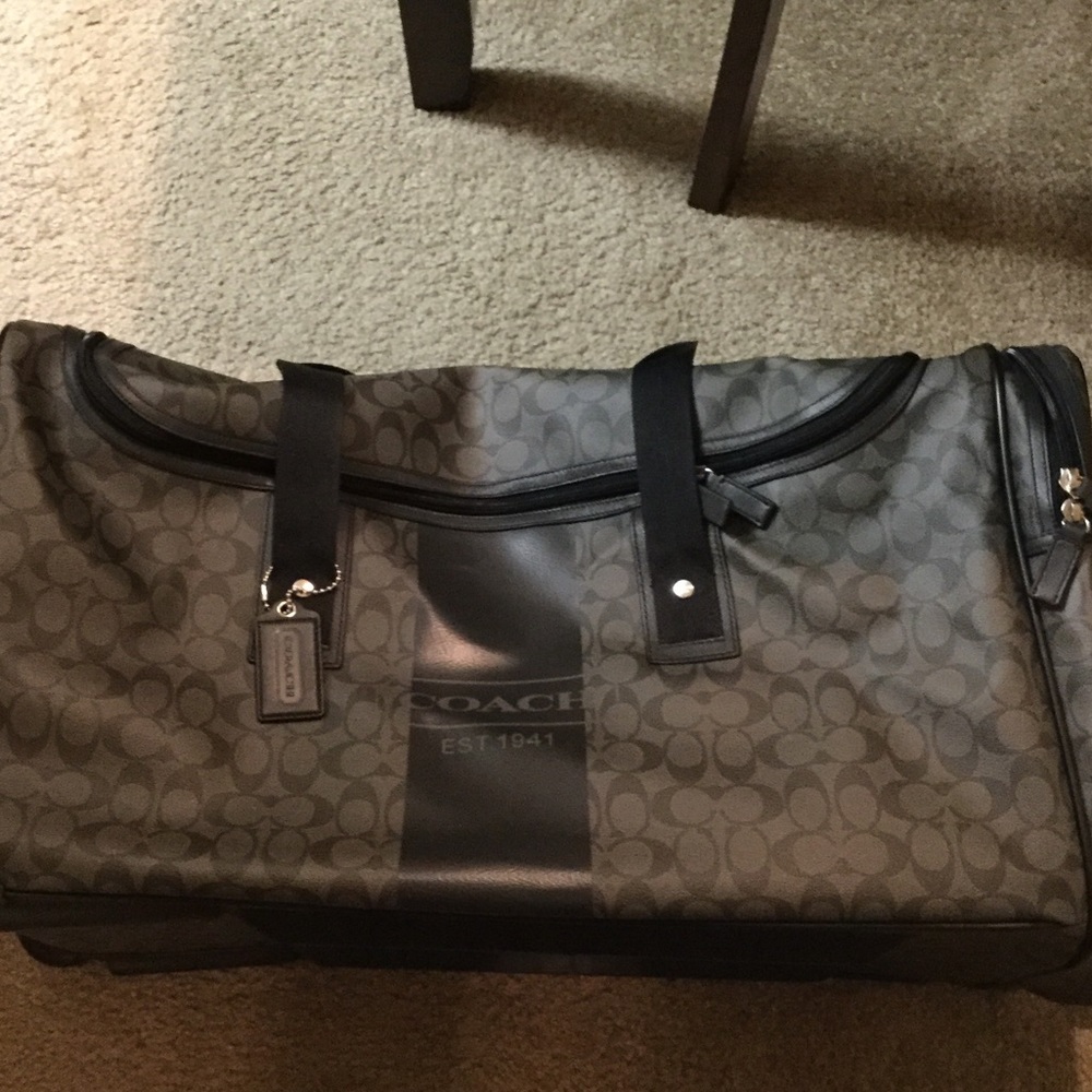 Coach leather signature luggage with roller