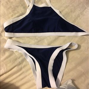 Never worn. Bathing suit