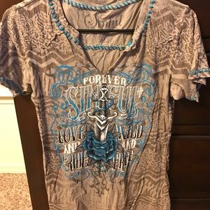 Large brown and blue Sinful Tee