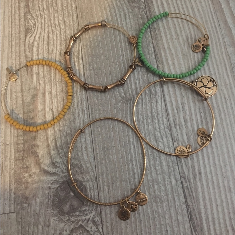Five gold Alex and Ani bracelets