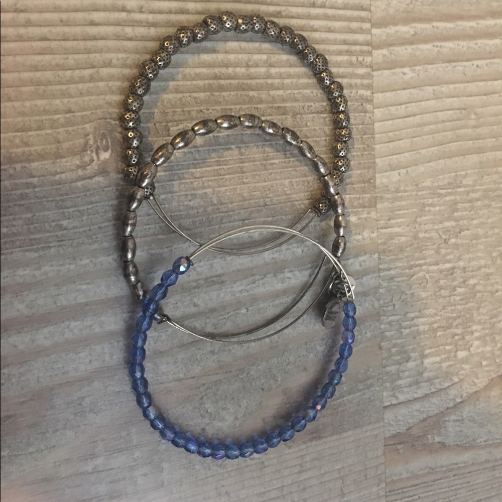 Three silver Alex and Ani bracelets