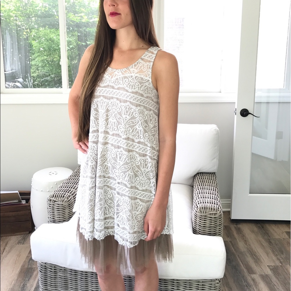 Boutique white lace dress with taupe lining