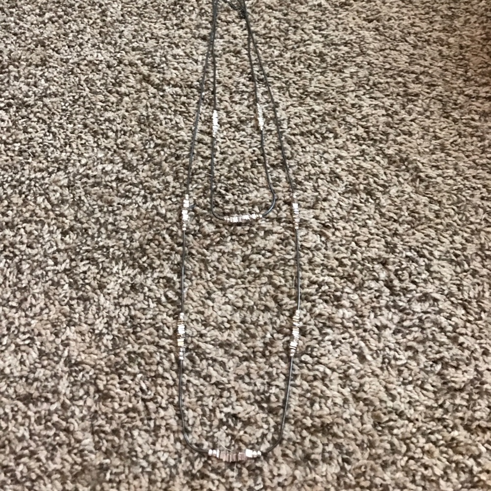 Long silver statement necklace.