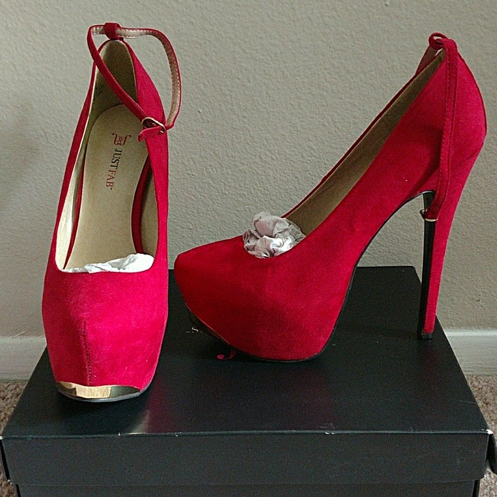 Red high heel with gold front bottom
