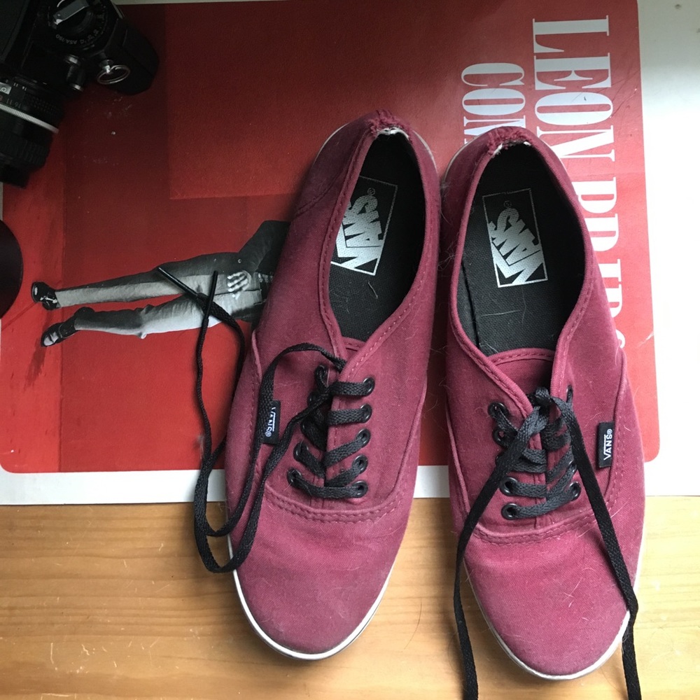 Red vans a little scuffed up
