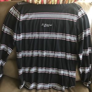 A hundreds sweater with blue white and red stripes