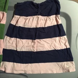 Strapless pink and navy blue striped top.