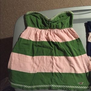 Strapless pink and green striped top.