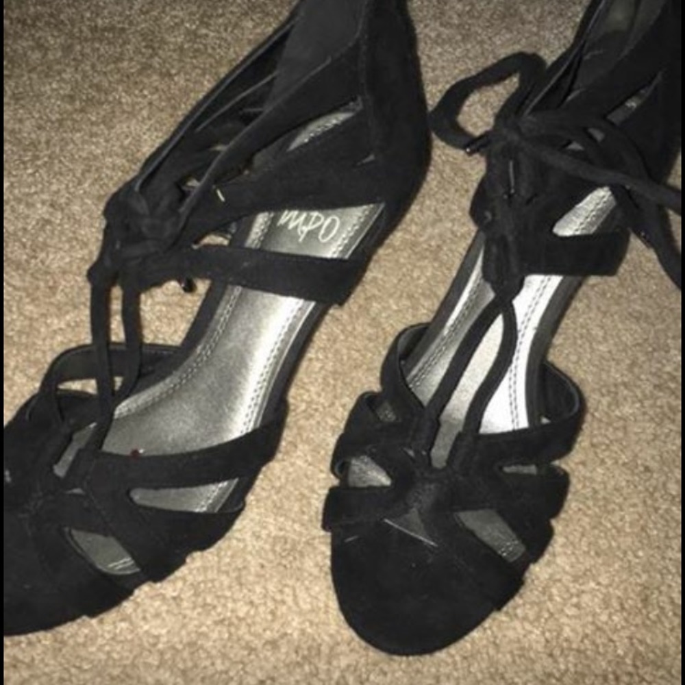 Selling the black open toed, laced up heels