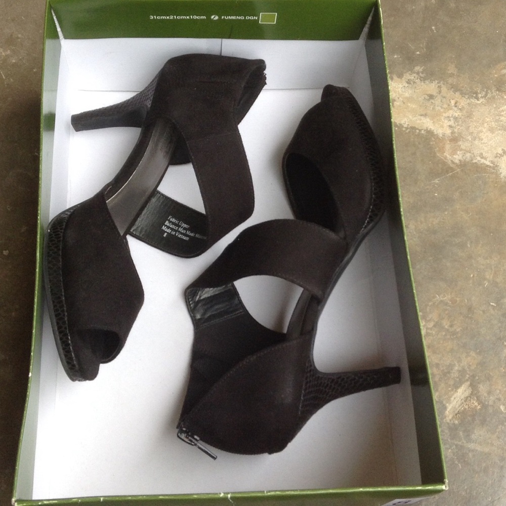 Black coach and four heels.