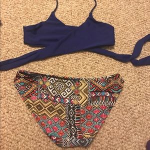 wrap navy blue bikini top and colorful bottoms
