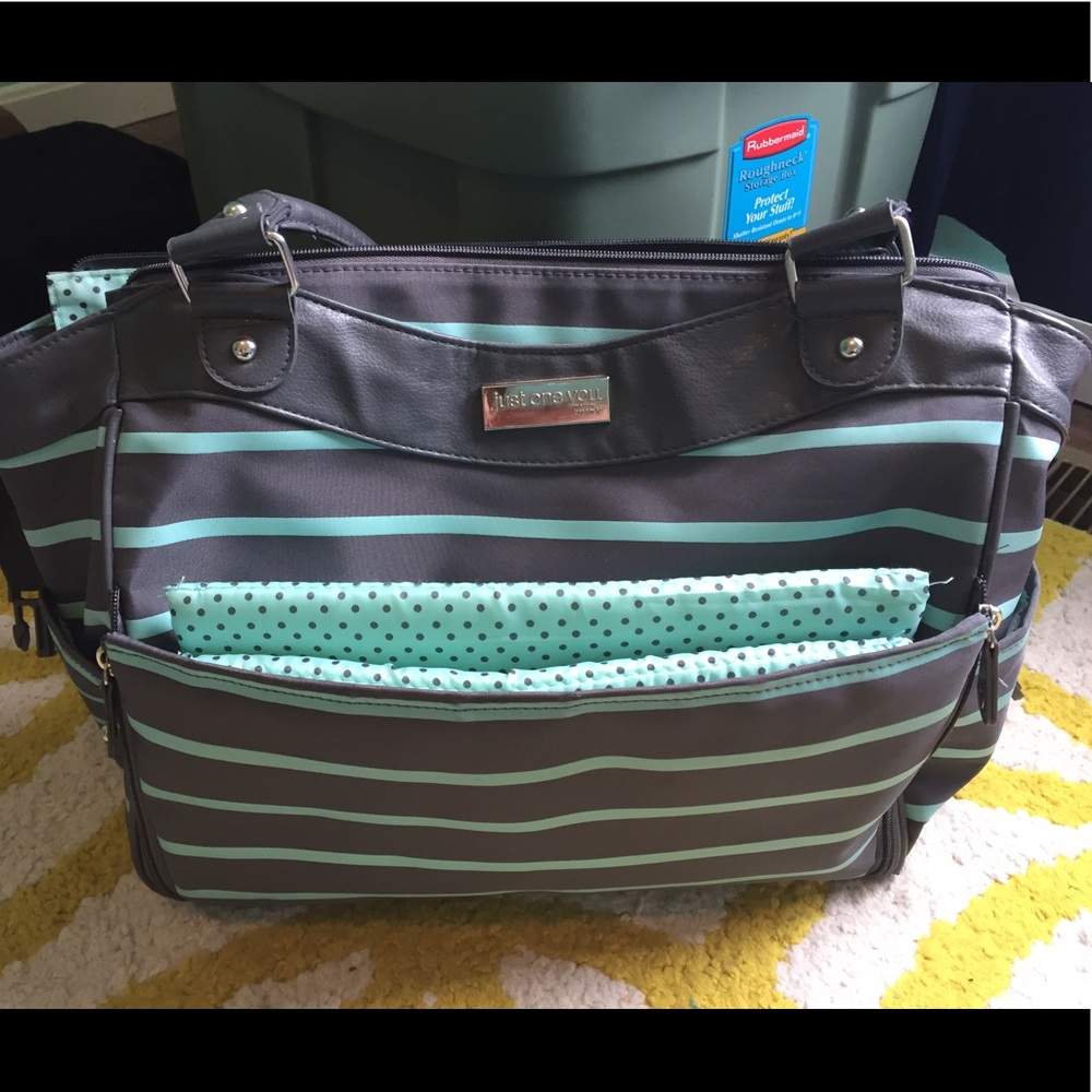 Mint green and gray Carters diaper bag.