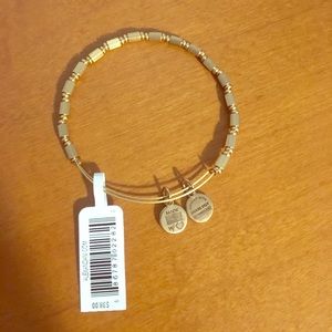 Unique gold Alex & Ani bracelet. New with tag.