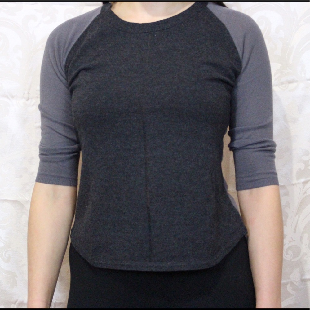 Dark and light gray sweater.