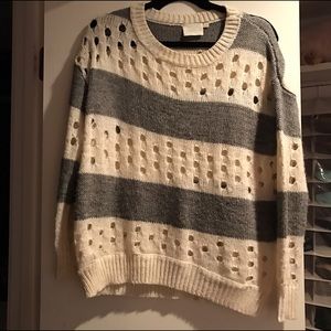 Gray and White sweater with Circle cutouts