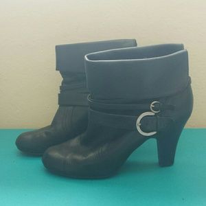 Black booties with silver buckles