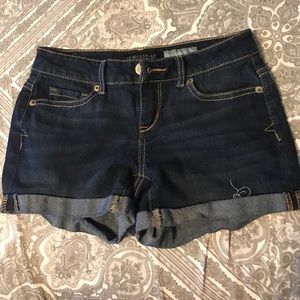 dark denim shorts.