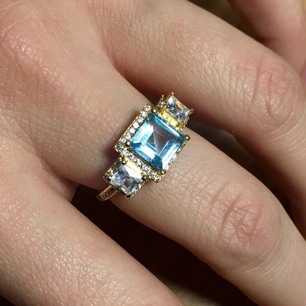 Blue and white topaz ring