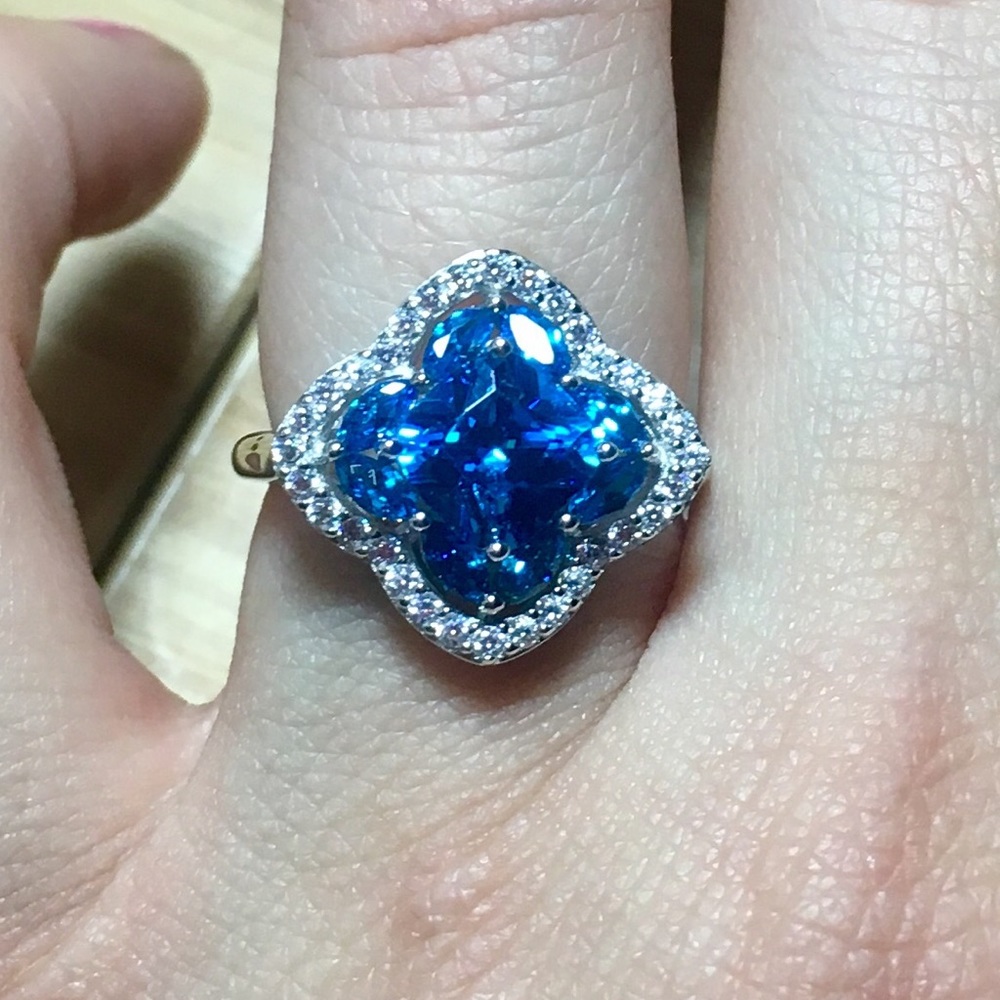 Blue topaz and white sapphire ring