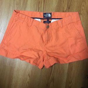 Orange North Face shorts