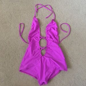 only worn once, magenta criss cross bodysuit