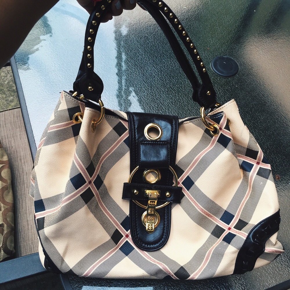 Women's studded gold accent handbag