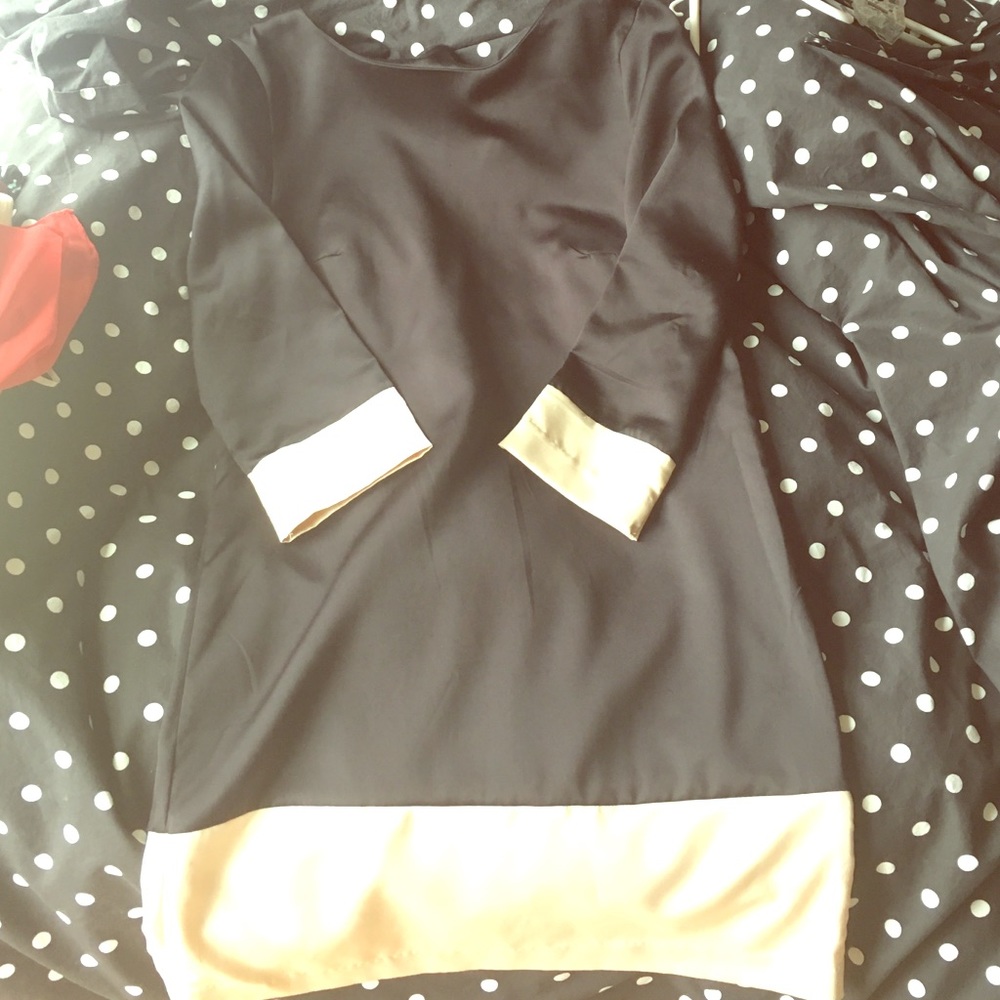 Silky black dress with ivory accents. Worn once.