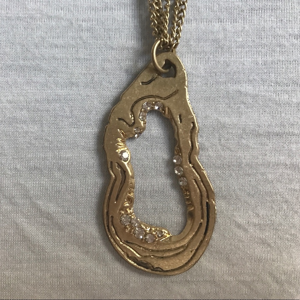 Gold multi-strand necklace with beautiful pendant