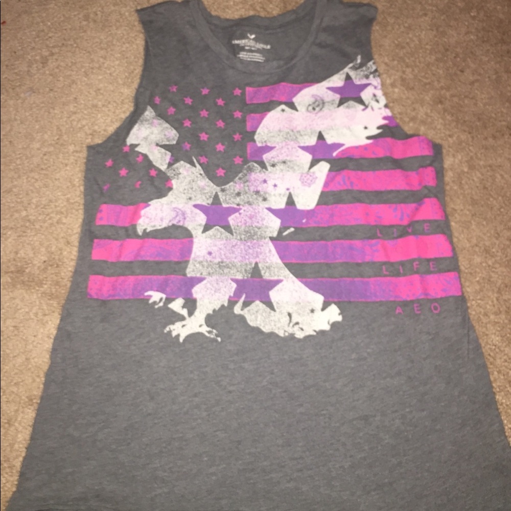item- a grey tank from with a eagle imprinted